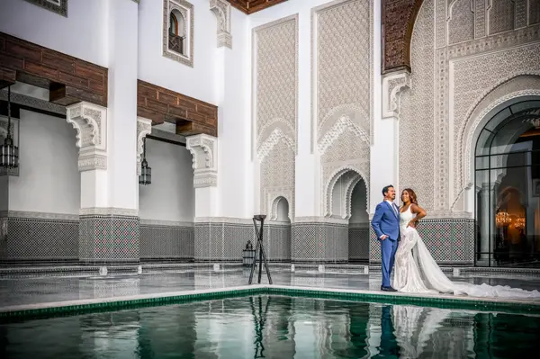 Couple portrait at Moroccan riad pool - marrakech photoshoot