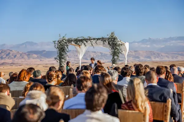 Desert wedding ceremony Agafay with Atlas Mountains backdrop - destination wedding photographer