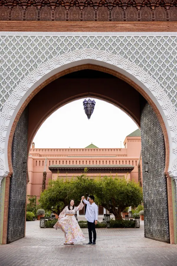 Couple dancing under Moroccan arch Royal Mansour - engagement photographer marrakech