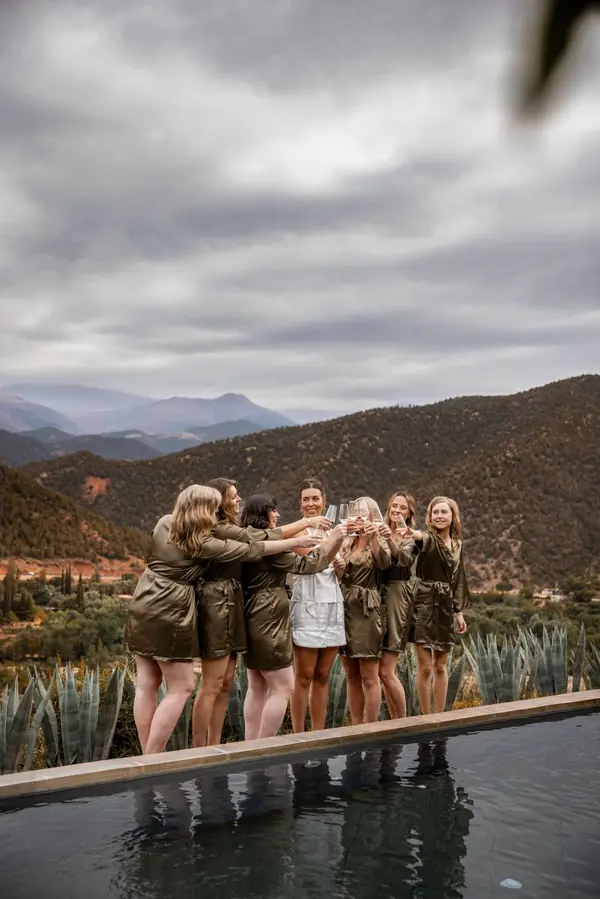 Bridesmaids champagne toast infinity pool Atlas Mountains - vacation photographer marrakech